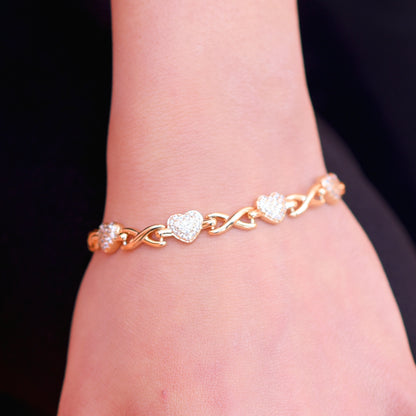 (Golden Hearts Bracelet) shown in close up from Al Musk Jewellery collection.